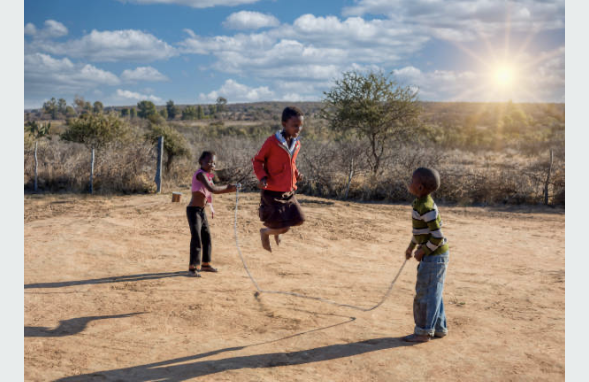 Pupils playing skipping rope outside